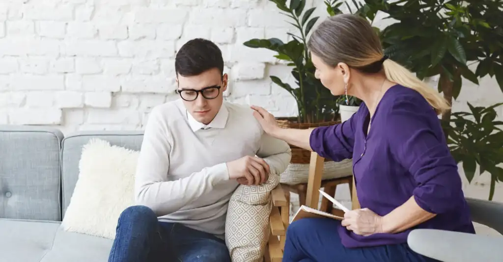 Therapist supporting a professional during counselling session for burnout recovery in Dubai